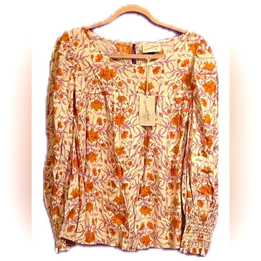 Fun floral blouse wwith pencil sleeves tapered at the wrist!